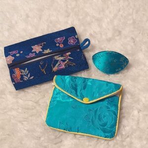 Three-piece Chinese fabric jewelry and accessory pouches.